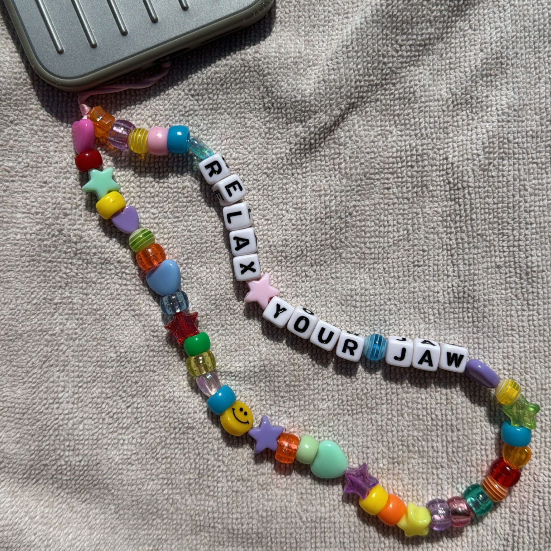 Relax Your Jaw Phone Charm